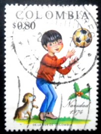 Selo postal da Colômbia de 1974 Boy Puppy and Soccer Ball