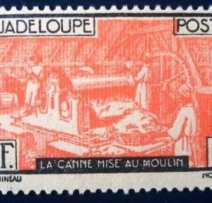 Selo postal de Guadalupe de 1928 Sugar cane in the mill